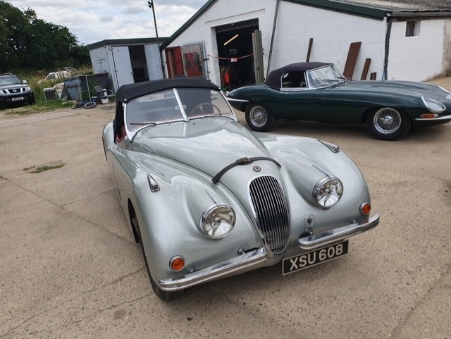 A grey Classic & Sportscar Centre 1954 Jaguar XK120 Roadster